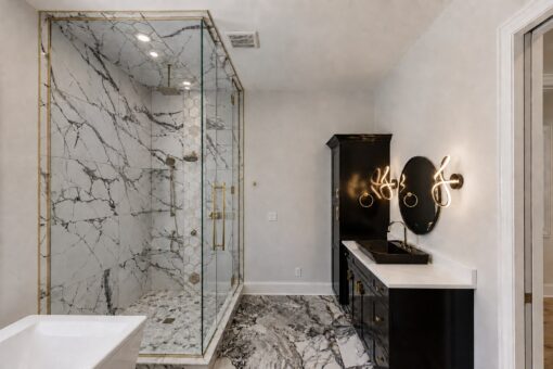 Apex primary bath marble shower and black vanity