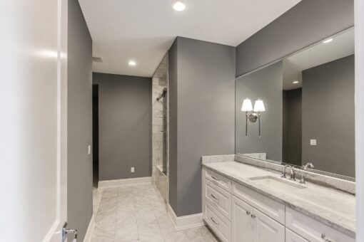 Ridge bathroom with gray walls and marble vanity