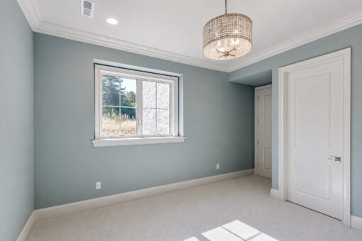 Ridge bedroom with light blue walls and drum chandelier