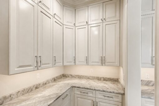 Ridge butler's pantry with white cabinetry