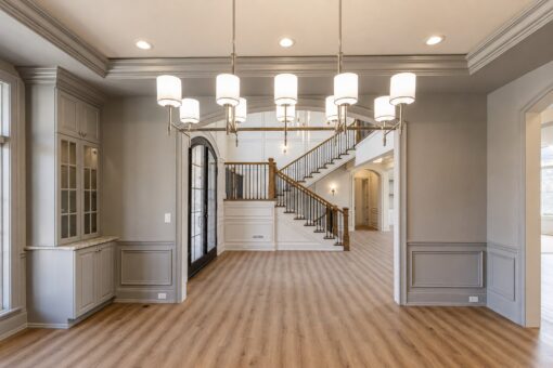 Ridge dining room with chandeliers and view to the staircase