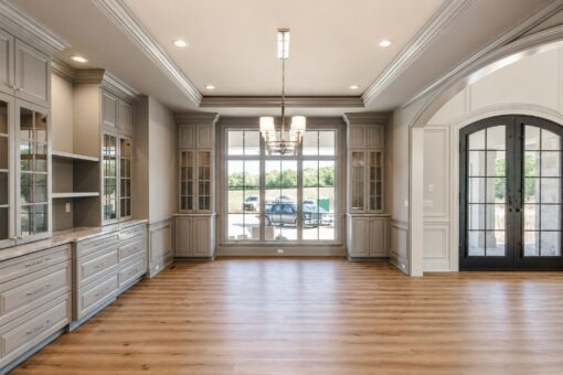 Ridge dining room with glass-front built-ins and iron French doors