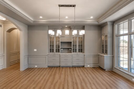 Ridge dining room with glass-front hutch and linear chandelier