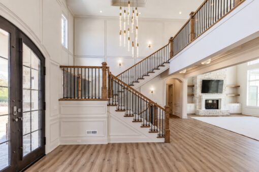 Ridge foyer with arched iron entry door and view to the great room