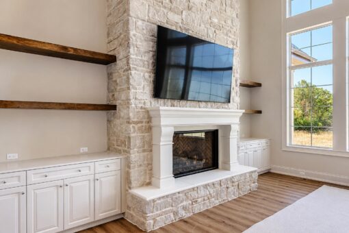 Ridge great room stone fireplace with floating shelves