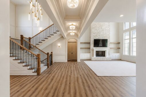 Ridge great room with stone fireplace and open staircase