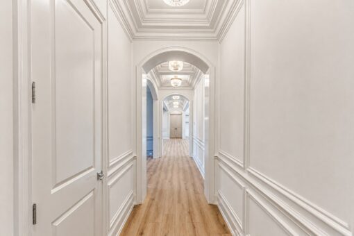 Ridge hallway with arched openings and wainscoting