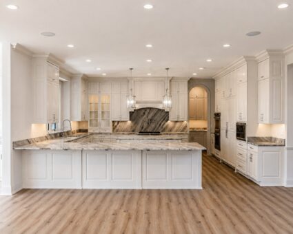 Ridge kitchen island with seating and marble backsplash