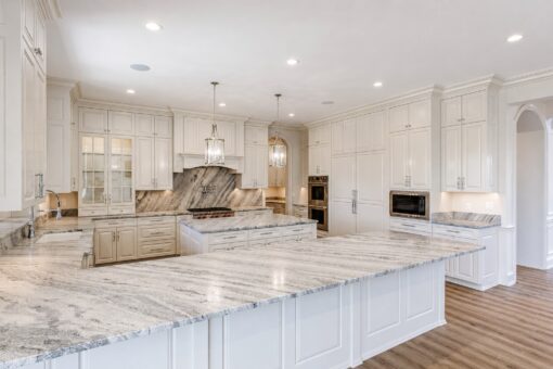 Ridge kitchen islands with marble tops and double ovens