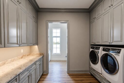 Ridge laundry room with gray cabinetry