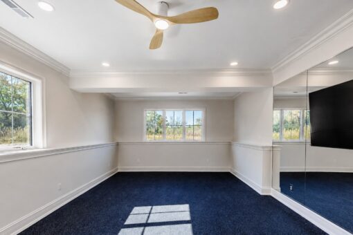 Ridge lower-level exercise room with ceiling fan