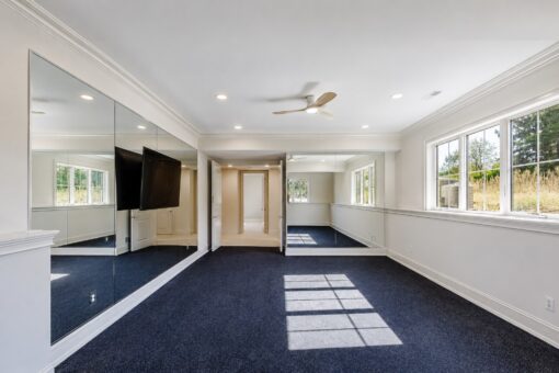 Ridge lower-level exercise room with mirrored wall