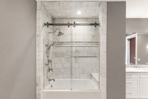 Ridge marble tub-shower with sliding glass door