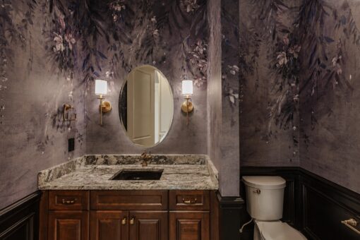 Ridge powder room with botanical wallpaper and wood vanity