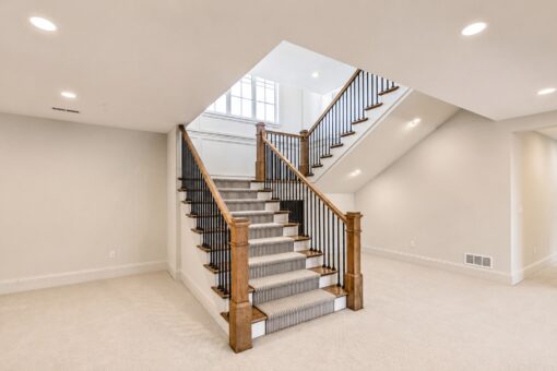 Ridge staircase to the lower level with carpet runner