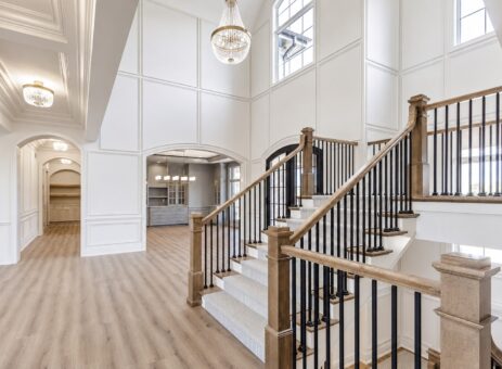 Ridge staircase with iron balusters and wood railing