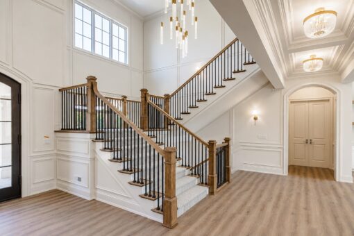 Ridge staircase with paneled walls and double doors
