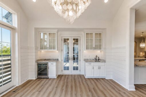 Ridge sunroom with wet bar and French doors