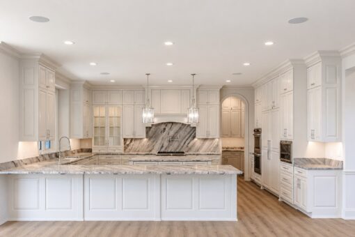 Ridge white kitchen with large island and marble backsplash